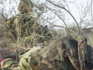 Israeli soldiers hold a position at an army deployment near the border with Gaza, on July 21, 2014