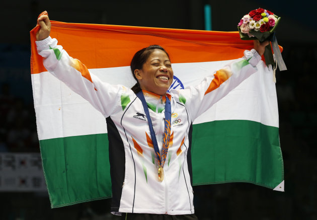 Mary Kom celebrates her gold medal in Incheon.
