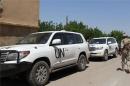 Syria arms inspectors under fire