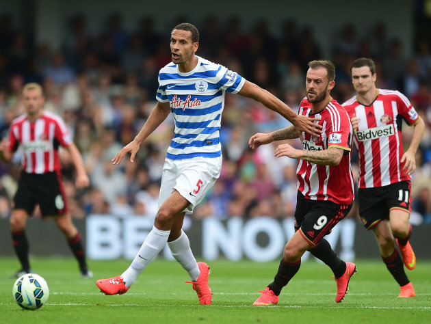 Queens Park Rangers&amp;#39; Rio Ferdinand, left, battles for the ball with Sunderland&amp;#39;s Steven Fletcher during their English Premier League soccer match at Loftus Road, London, Saturday, Aug. 30, 2014. (AP Photo/Adam Davy, PA Wire) UNITED KINGDOM OUT - NO SALES - NO ARCHIVES