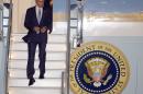 President Barack Obama walks down the stairs of Air Force One upon his arrival at San Francisco International Airport, Tuesday, July 22, 2014, in San Francisco. (AP Photo/Tony Avelar)