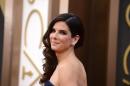 FILE - In this March 2, 2014 file photo, Sandra Bullock arrives at the Oscars at the Dolby Theatre, in Los Angeles. Bullock's encounter with a stalker in her home reads like a scene from a scary movie in newly released documents, painting a portrait of an obsessed fan who described himself as her “husband.” Bullock, who has portrayed brave, strong women on screen, took quick action, locking the door and summoning police. (Photo by Jordan Strauss/Invision/AP, file)