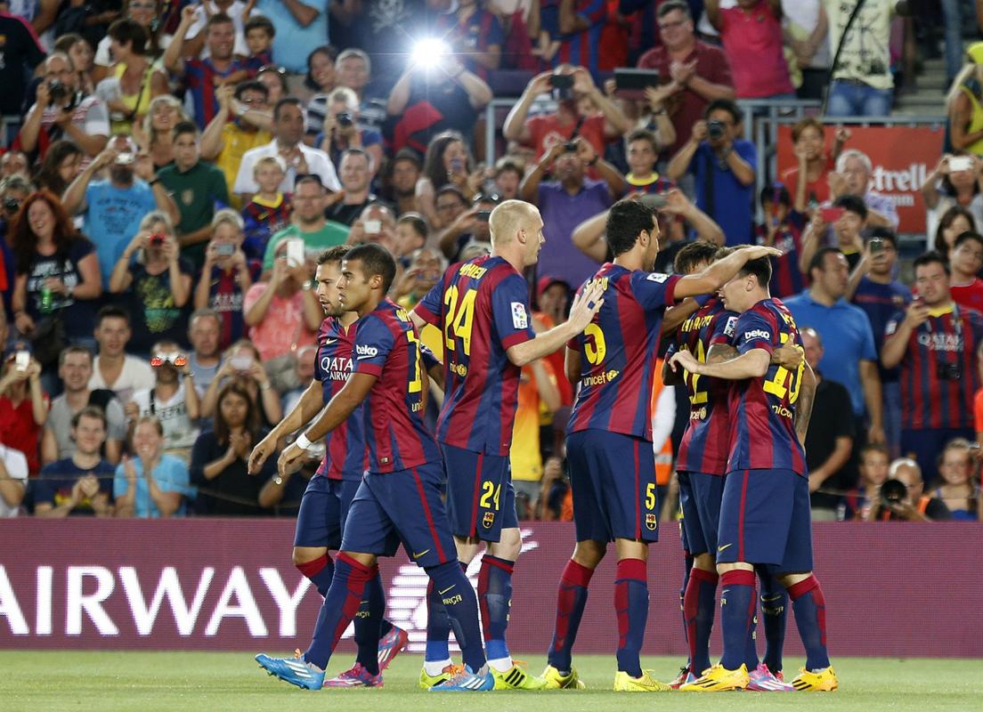 FC Barcelona's players celebrates Messi's goal against Mexican club Leon FC during their Joan Gamper Trophy soccer match at Nou Camp stadium...