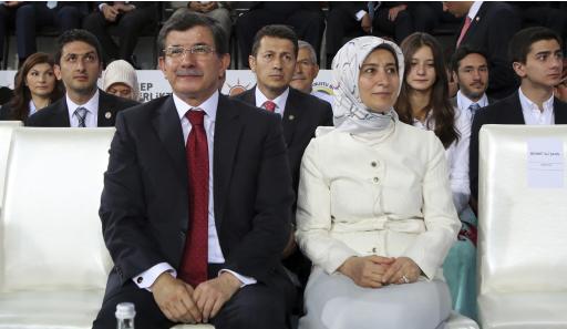 Turkey's Foreign Minister Davutoglu and his wife attend the Extraordinary Congress of AKP in Ankara