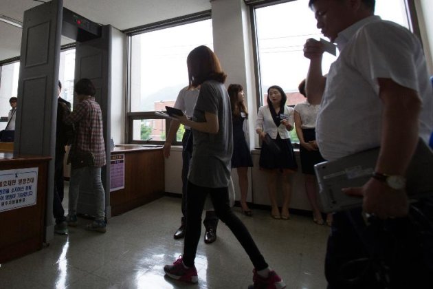 Family members of victims of the Sewol ferry disaster arrive at the district court in the southwestern South Korean city of Gwangju, on June 24, 2014