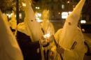 Supporters dressed as members of the Ku Klux Klan   light flares as they express anti-Semitic views in Lviv