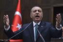 Turkey's Prime Minister Tayyip Erdogan addresses   members of parliament from his ruling AK Party during a meeting at the Turkish   parliament in Ankara