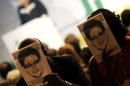 People hold masks depicting Edward Snowden during the   NETmundial: Global Multistakeholder Meeting on the Future of Internet Governance   in Sao Paulo