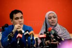 Lawyer Syahredzan Johan (left) with Norhayati Ismail, one of those behind the &#39;I Want to Touch a Dog&#39; event, who accompanied social activist Syed Azmi Alhabshi, at the press conference today. – The Malaysian Insider pic by Afif Abd Halim, October 25, 2014.