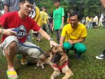 Organiser Syed Azmi Alhabshi (right) gingerly pets a German Shepherd. – Pic used with permission, October 19, 2014.