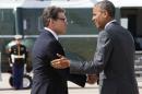 President Barack Obama, right, and Texas Gov. Rick Perry shake hands as Obama arrives in Dallas where they will attend a meeting about the border and immigration together, Wednesday, July 9, 2014. (AP Photo/Jacquelyn Martin)