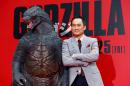 Japanese actor Ken Watanabe poses for photographers during the Japan premiere of his movie "Godzilla" in Tokyo, Thursday, July 10, 2014. (AP Photo/Shizuo Kambayashi)