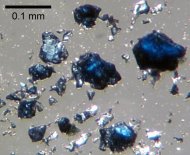 Fragments of the blue-colored mineral ringwoodite synthesized in the laboratory.