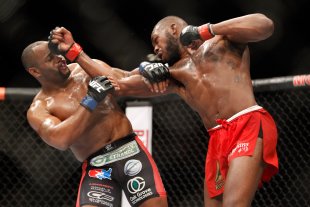 Jon Jones punches Daniel Comier during the UFC 182 main event. (Getty)