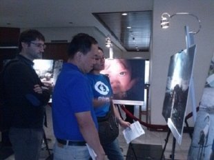 Guests view the photo exhibit showcasing Filipino resiliency.