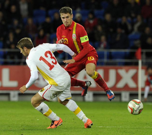 Wales' Ramsey is challenged by Macedonia's Ristovski during their 2014 World Cup qualifying soccer match in Cardiff, Wales