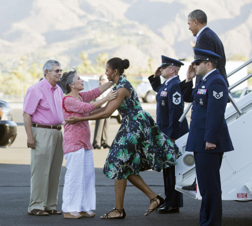 President Barack Obama and first lady Michelle Obama, are greeted on the tarmac by Sen. Barbara Boxer, D-Calif., second from left, and her husband Stewart Boxer, left, as they arrive on Friday, June 13, 2014, in Palm Springs, Calif. (AP Photo/Manuel Balce Ceneta)