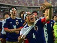 Local football fans are disappointed as Japan is defeated by Ivory Coast in their Group C match of the FIFA World Cup, as seen from the Tokyo Dome stadium, on June 15, 2014