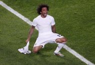 Real Madrid's Marcelo celebrates after scoring a goal against Atletico Madrid during their Champions League final soccer match at the Luz Stadium in Lisbon May 24, 2014. REUTERS/Sergio Perez