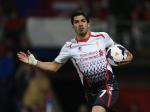 Liverpool's Luis Suarez celebrates after scoring his side's third goal a goal during the English Premier League soccer match between Crystal Palace and Liverpool at Selhurst Park stadium in London, Monday, May 5, 2014