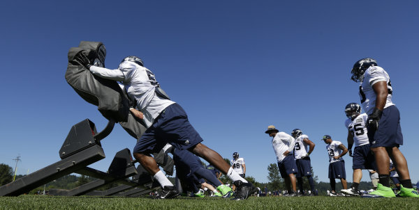Seattle Seahawks Defensive Players Push A Blocking Sled During Nfl Football Training Camp