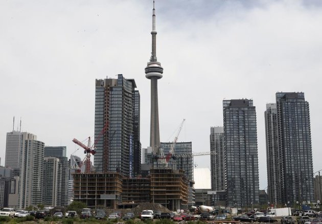 Condo buildings are seen under in construction in Toronto June 19, 2009. REUTERS/Chris Roussakis