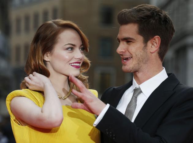 Actors Emma Stone and Andrew Garfield pose for photographs at the world premiere of The Amazing Spiderman 2 in central London
