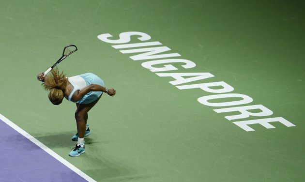 In this photo released by the World Sport Group, Serena Williams of the U.S. smashes her racket in frustration during her semifinal match against Denmark&amp;#39;s Caroline Wozniacki at the WTA tennis finals in Singapore, Saturday, Oct. 25, 2014. (AP Photo/World Sport Group, Paul Lakatos)