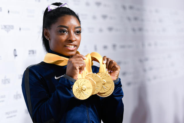 13 October 2019, Baden-Wuerttemberg, Stuttgart: Gymnastics: World Championships, apparatus finals, women: Simone Biles from the USA has 5 gold medals in her hands. Photo: Tom Weller/dpa (Photo by Tom Weller/picture alliance via Getty Images)
