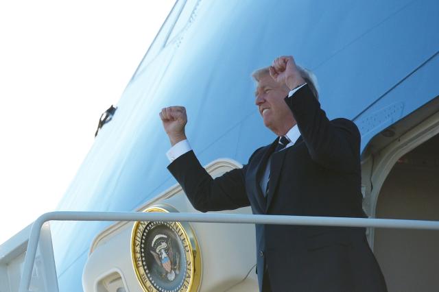 President Donald Trump steps off Air Force One upon arrival for an appearance in Greer, South Carolina, on Oct. 16, 2017. (MANDEL NGAN via Getty Images)