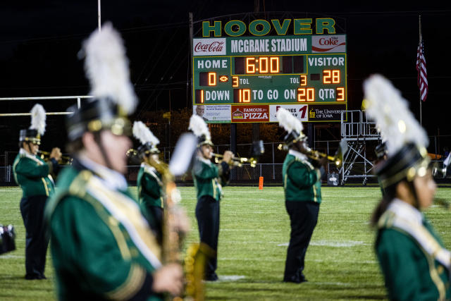 A scoreboard displays a 28-point deficit as Hoover High School competes during a home game in Des Moines, Iowa, Sept. 6, 2019.(KC McGinnis/The New York Times)