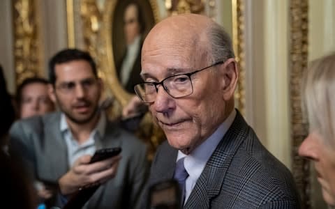 Republican Senator Pat Roberts of Kansas, chairman of the Senate Agriculture Committee, speaks briefly to reporters after he opened and closed a brief session of the Senate on Thursday - Credit: Scott Applewhite/ AP