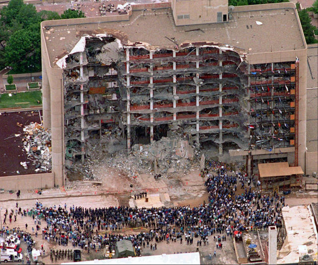 A large group of search and rescue crew attends a memorial service in front of the Alfred P. Murrah Federal Building in Oklahoma City on May 5, 1995. The blast killed 168 people _ including 19 children _ injured hundreds more and caused hundreds of millions of dollars in damage to structures and vehicles in the downtown area. (Photo: Bill Waugh/AP)