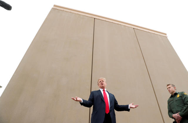 President Donald Trump speaks at an installation of U.S.-Mexico border wall prototypes near the Otay Mesa Port of Entry in San Diego on Tuesday. (Kevin Lamarque / Reuters)