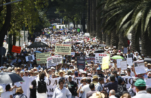 Protesters march against the policies of Mexican President Andrés Manuel López Obrador during his first state of the nation address in Mexico City, Sunday, Sept. 1, 2019. (AP Photo/Ginnette Riquelme)
