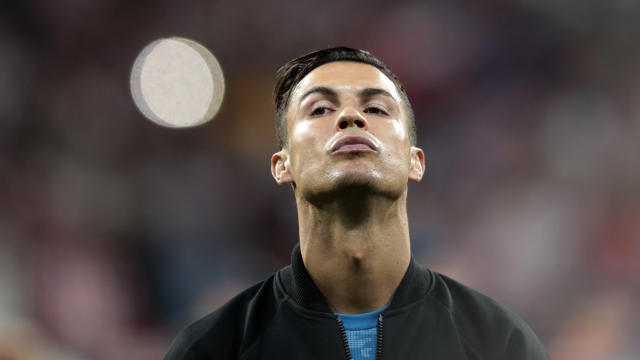 Juventus' Cristiano Ronaldo looks up during the line up prior to the Champions League Group D soccer match between Atletico Madrid and Juventus at the Wanda Metropolitano stadium in Madrid, Spain, Wednesday, Sept. 18, 2019. (AP Photo/Bernat Armangue)