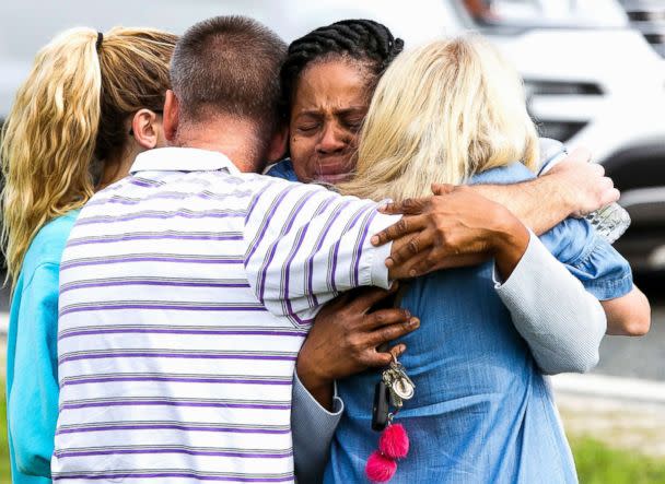 PHOTO: Nikki Brown, center, hugs others in front of Forest High School on April 20, 2018 in Ocala, Fla. (Doug Engle /Star-Banner via AP)