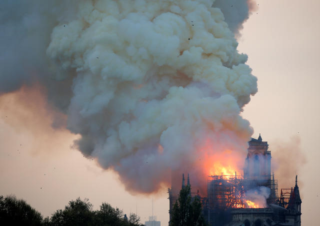 Smoke billows from Notre Dame Cathedral after a fire broke out, in Paris, France April 15, 2019. REUTERS/Charles Platiau