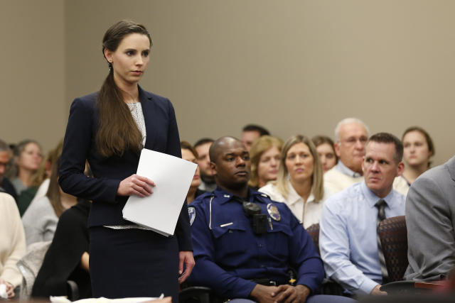 Rachael Denhollander speaks as former Michigan State University and USA Gymnastics doctor Larry Nassar listens to impact statements during the sentencing phase in Ingham County Circuit Court on January 24, 2018 in Lansing, Michigan. More than 100 women and girls accuse Nassar of a pattern of serial abuse dating back two decades, including the Olympic gold-medal winners Simone Biles, Aly Raisman, Gabby Douglas and McKayla Maroney -- who have lashed out at top sporting officials for failing to stop him. / AFP PHOTO / JEFF KOWALSKY (Photo credit should read JEFF KOWALSKY/AFP via Getty Images)