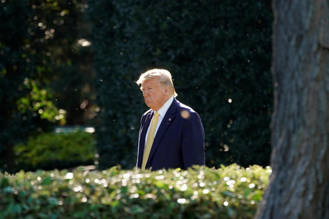 President Trump on the South Lawn of the White House before his departure to deliver remarks at a Keep America Great Rally in Lake Charles, La. (Photo: Yuri Gripas/Reuters)