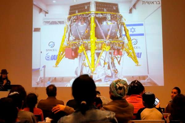 People watch a screen showing explanations of the landing of Israeli spacecraft, Beresheet's, at the Planetaya Planetarium in the Israeli city of Netanya, on April 11, 2019 before it crashed during the landing. (Photo by JACK GUEZ / AFP)JACK GUEZ/AFP/Getty Images