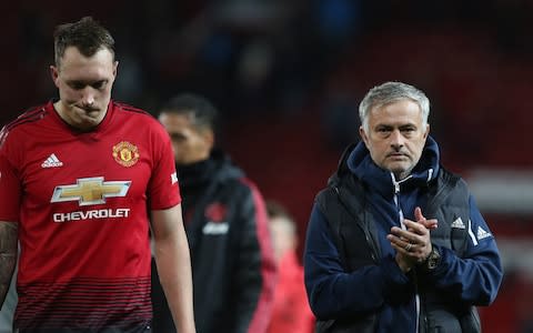 Phil Jones and manager Jose Mourinho trudge off after defeat - Credit: Getty images