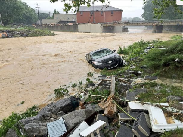 PHOTO: In this photo released by The Weather Channel, a vehicle rests in a stream after heavy rain near White Sulphur Springs, W.Va., June 24, 2016. (Justin Michaels/The Weather Channel via AP)