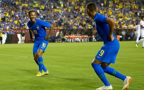 Neymar and Richarlison celebrate a goal on international duty - Credit: AP