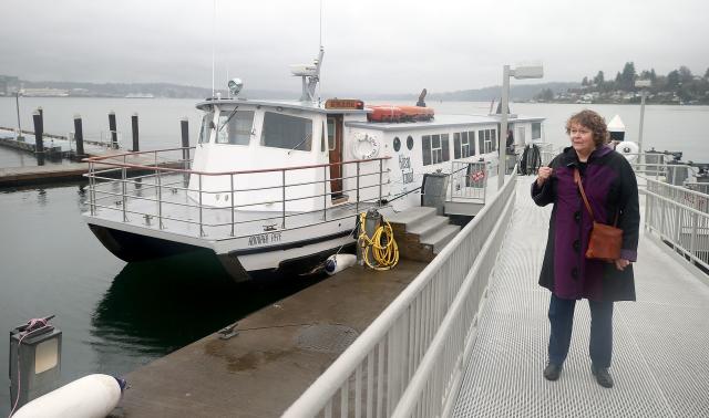 Carol Carlson of Edmonds, Washington, stands Dec. 28, 2018, at the Port Orchard, Washington, passenger ferry to Bremerton. In December 2017, State troopers took her to jail, accusing her of drunk driving. When she was released, she eventually wandered to the ferry.