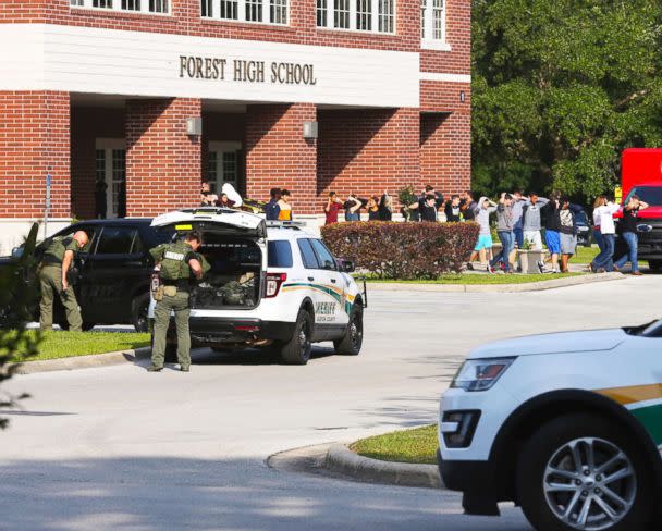 PHOTO: Students are led out of Forest High School as law enforcement agents prepare to enter the school on April 20, 2018, in Ocala, Fla. (Bruce Ackerman/Star-Banner via AP)