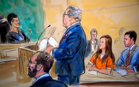 A courtroom sketch depicts Maria Butina, in orange suit listening to her attorney Robert Driscoll as he speaks to Judge Deborah Robinson during a hearing in federal court in Washington, Wednesday, July 18, 2018 - Credit: Dana Verkouteren/AP
