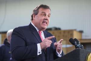 New Jersey Governor Chris Christie speaks to media and homeowners about the ongoing recovery from Hurricane Sandy in Manahawkin, New Jersey